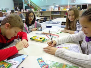 4th_Library_centers_1 Students enjoying the fourth grade centers in the library.
