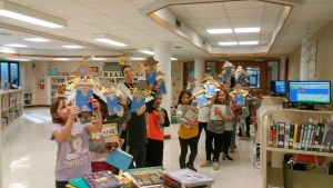 Scarecrows_2 First graders with the puppet scarecrows they made in library.